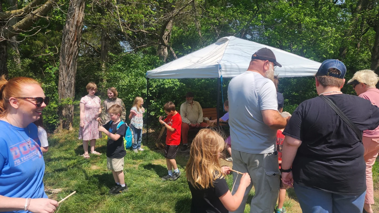 Children at the candle-dipping station at Rocky Mount during the Saturday public day.